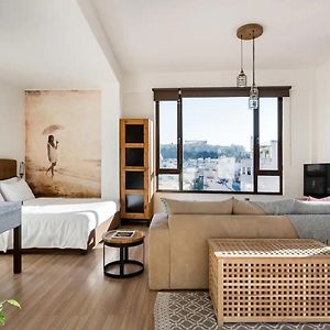 Explore Nightlife Near An Apartment With An Acropolis View