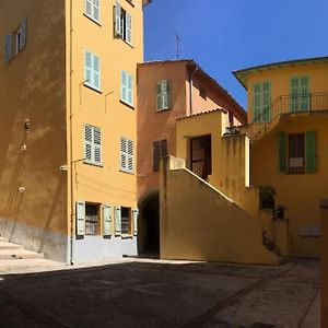 Between The Roofs Of Menton Old Town And The Sea